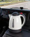 Heavy Duty 24V Electric Kettle For Trucks Built Like A Tank With Auto Shut Off 1 Liter Portable Water Heater on truck dashboard.