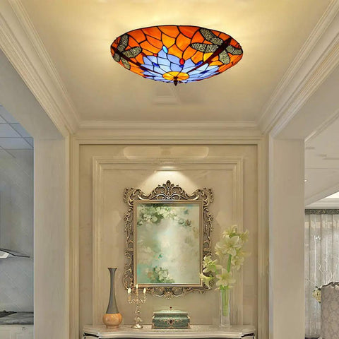 Dragonfly 3 Light Flush Mount Ceiling Light With Orange Stained Glass Shade 16 Inch Diameter Glass Fixture in elegant room