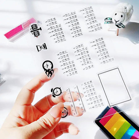 Fresh Date Week Month Year Calendar Clear Silicone Stamp Set For DIY Scrapbooking And Holiday Cards Featuring Alarm Clock Arabic Numerals Legit Quality Craft Kit held in hand showing clock and numeral designs.