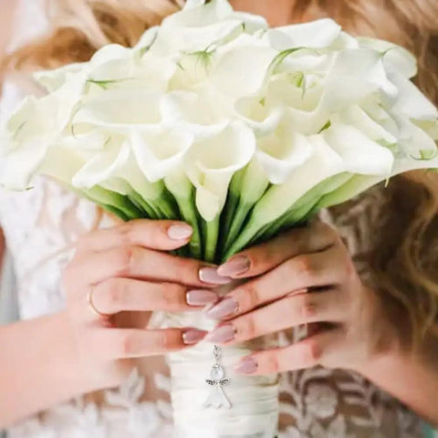 Bride holding a bouquet of white flowers with DIY Guardian Angel Pendant Kit attached, featuring 420 pieces beads and alloy wings