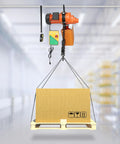 Tough As Nails 1300W Electric Chain Hoist Featuring Pure Copper Motor lifting a cardboard box from a pallet in a warehouse.