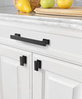 Close-up of 5-inch matte black kitchen cabinet handle on white drawer, part of 30 Pack 5 Inch Matte Black Kitchen Cabinet Handles And Drawer Pulls.