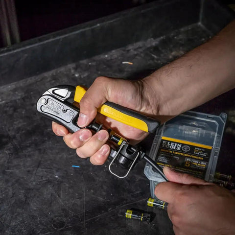 Pro Grade Heavy Duty Compression Crimper for Wire and Coaxial Cabling with Indoor and Outdoor Use held in hand on workbench