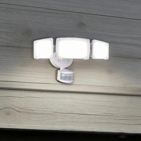 Patriot Lighting White Tri-Head 180° Motion Sensing LED White Security Flood Light Ceiling Light with three bright panels.