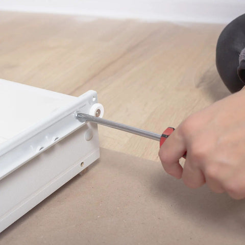 Heavy Duty 16 Inch Bottom Mount Drawer Slides Set 6 Pairs With Mounting Screws White Finish Rust Resistant Cold Rolled Steel Rails Easy Install Replacement Drawer Track Hardware for Bottom Or Side Mount Drawers being installed with screwdriver