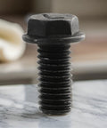5-Pack Heavy Duty M8 X 18mm Left Hand Thread Hex Flange Screws Made From High Strength Carbon Steel For Industrial Cutting Machines And Reverse Rotation Blade Securement To Stop Loosening Under Stress In Workshop Jobs close-up of a hex flange screw with threaded shaft