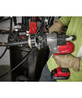 Milwaukee M18 Cordless Cable Stripper Bare Tool Adjustable Depth Gauge removing insulation from 2.1 inch wire.