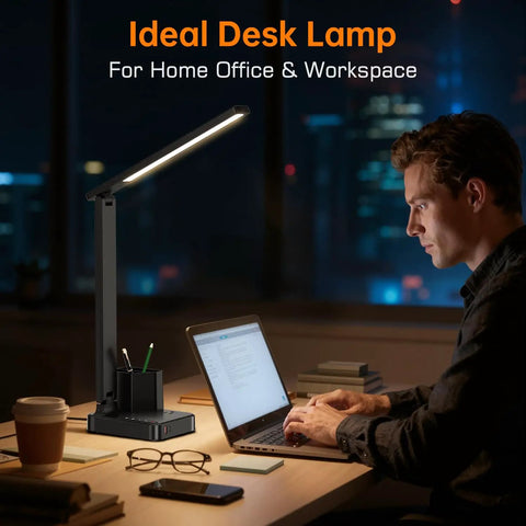 LED Desk Lamp For Home Office With USB Ports And AC Outlet on desk, man using laptop in dimly lit room, ideal for workspace