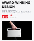 Person holding a white portable digital display case with handle, award-winning 2022 iF and 2023 Red Dot Design awards.