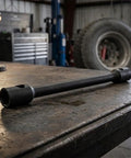 Heavy Duty Extended Double Ended Socket Wrench Set Rock Solid Hex Head on a workbench in a garage, crafted for tough automotive tasks.