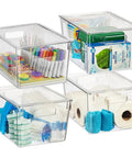 X Large Plastic Storage Bins With Lids For Kitchen Pantry Refrigerator Organization filled with household items and toiletries.