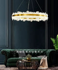 Chic Round Gold LED Pendant Light With Cut Diamond Glass Shade Dimmable Hanging Lamp For Modern Spaces Top Tier Smooth Glow Ceiling Setup Hits Different, hanging over a green sofa.