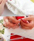 Close-up of Upgraded DIY Rope Threader Clip Set with stainless steel hooks and latch, threading fabric channels.