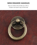 Go To Vintage European Style Zinc Alloy Cabinet Knobs And Mini Drawer Handles Set In Black And Antique Bronze close-up on wood