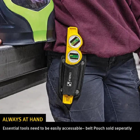 Person wearing die cast torpedo level with protractor vial and adjustable 360 degree vial in belt pouch.