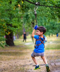 Slackline Pulley With Carabiner For Kids Backyard Zipline And Slackline Training Essentials in park setting with child using it