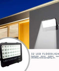 JUDYSSY Solar Flood Lights Led Flood Light, 30W 3000Lm Ip65 Waterproof Outdoor Security Light mounted on a wall.