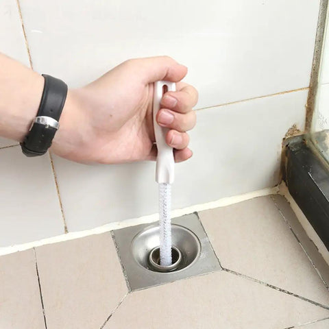 Person using Sink Drain Overflow Cleaning Brush 17.7 Inch Long Flexible Hair Catcher For Stubborn Clogs No Fuss Tool