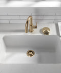 Premium Champagne Bronze Sink Garbage Disposal Flange Replacement Ring in undermount sink with brushed gold faucet.