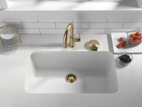Premium Champagne Bronze Sink Garbage Disposal Flange Replacement Ring in undermount sink with brushed gold faucet.