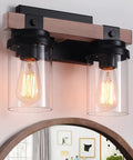 Two Light Farmhouse Vanity Light Over Mirror With Faux Wood Grain Finish, displaying E26 bulb base and rustic glass shades.
