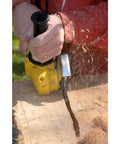 No Bull 4 Inch 14 Tooth Carving Saw Disc For Angle Grinders in use, showcasing heavy wood removal with a yellow angle grinder.