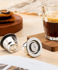 Stainless Steel Reusable Espresso Capsule Pod With Lid For Home Brewing Barista Grade Crema Style Coffee Capsule on table