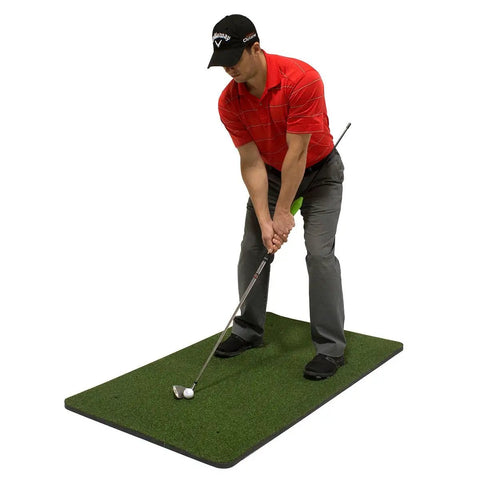 Golfer using Chip Stix Golf Swing Trainer Aid Chip N Pitch Mastery Black And Green Improve Short Game With More Spin Fix Common Swing Faults Practice Tool For Consistent Swings And Lower Scores on a practice mat