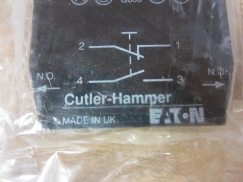 Cutler Hammer CHE22B11 black contact block with electrical symbols and labels for high amp switch module use.
