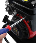 Person using screwdriver on engine close-up