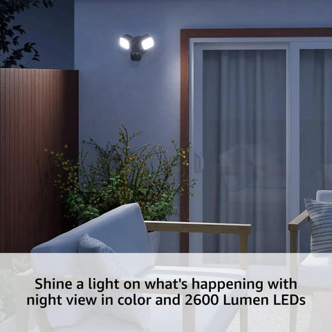 Outdoor Wired Floodlight Security Camera With 2600 Lumen LED Lights installed on wall, illuminating patio with color night vision.