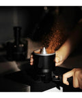 Espresso Gang Verified Shaker Funnel With Built In Dosing Cup For 58mm Portafilter distributing coffee grounds evenly.