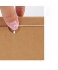 Close-up of 20 Pack One Size Folding Corrugated Cardboard Mailing Boxes For Biz Shipping And Gift Packaging Kraft Paper Express Boxes