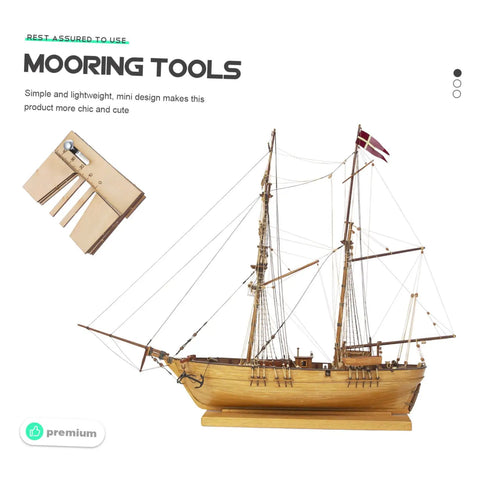 Wooden Mooring Tools Set for Ship Building Models displayed with model sailboat and tool kit on white background.