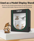 Image showing a black and green model display stand with 3D printed models on shelves, resembling the Ultimate 3D Printer Filament Storage Box With 2 Tier Shelves For Your Studio Office Or Workshop Keeps Up To 10 Filaments Neat And Accessible For Nonstop Printing.