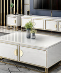 Modern living room with white cabinets featuring gold edge pulls and half moon handles