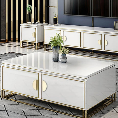 Modern living room with white cabinets featuring gold edge pulls and half moon handles
