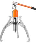 Hydraulic gear puller with orange pump and three steel jaws for hub removal.