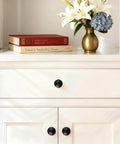 10 Pack Matte Black Cabinet Knobs For Kitchen Cabinets Round Ball Pulls With Single Hole Design Zinc Alloy Hardware installed on white cabinet drawers