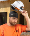 Man wearing black skull cap under white hard hat, demonstrating Rapid Cooling Helmet Liner For Hard Hats Breathable Skull Cap Under Helmet