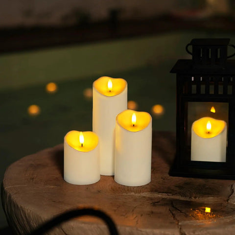 Remote Controlled Flameless LED Candles with Timer for Weddings and Parties on a wooden table beside a lantern