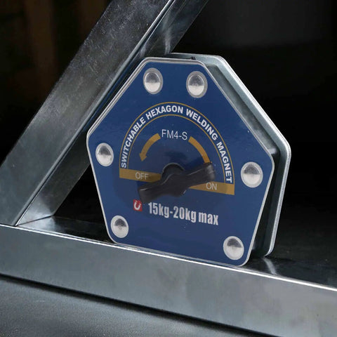 Solid One Button Degaussing Magnetic Welding Locator For Steel And Iron Pipe With 25 Kilos Suction Power Super Strong Multi Angle Positioning Fixture Tool For Heavy Duty Welding Projects displayed next to metallic surface.