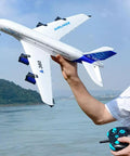 Person holding RC Airplane A380 Four Motor Two Point Four G Remote Control Plane With LED Lights Crash Resistant EPP Airliner