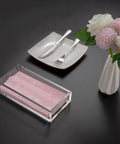 Crystal Clear Acrylic Napkin Holder Tray With 8mm Thick Build, Inner 8.3 By 4.7 By 2.2 Inches on table with pink napkins