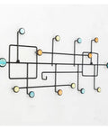Top Shelf Wrought Iron Double Wall Hooks For Coats And Gear Rustic Entryway Organizer against a wall with colorful round accents.