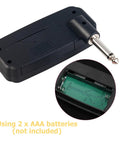 Portable Guitar Headphone Amp For Quiet Practice JA-01 battery compartment and plug view, compact desktop device.