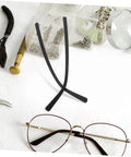 DIY Replacement Glasses Arms Temples Kit For Easy Installation And Quick Frame Repairs Durable Universal Eyeglasses Legs displayed on a table with repair tools.