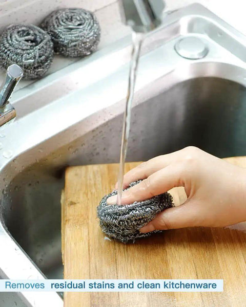 Hand using Heavy Duty Stainless Steel Scrubber Pads For Tough Kitchen Scrubbing On Dishes Pots Pans Ovens Grills And Sinks