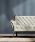 Blue Floral Stripe Wallpaper Featuring Silver Metallic Accents And Textured Fibrous Weave For Dope High End Vibes in living room with sofa.