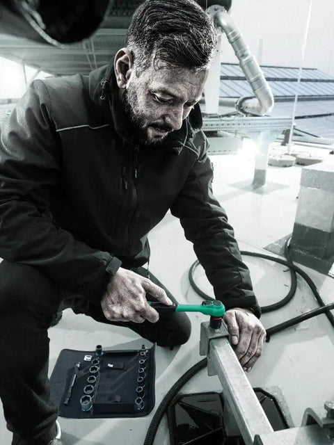 Person using Zyklop Comfort Ratchet With Reversing Lever Three Eighths Inch Drive 230 mm Length Slim Ergonomic Grip 80 Tooth Gear